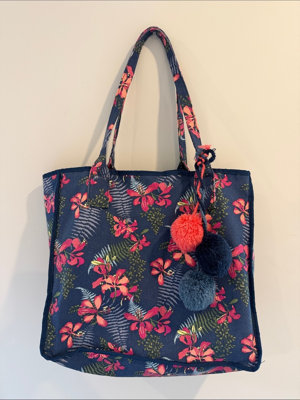 Tommy Bahama Navy Floral Tote with Pom Pom Accents